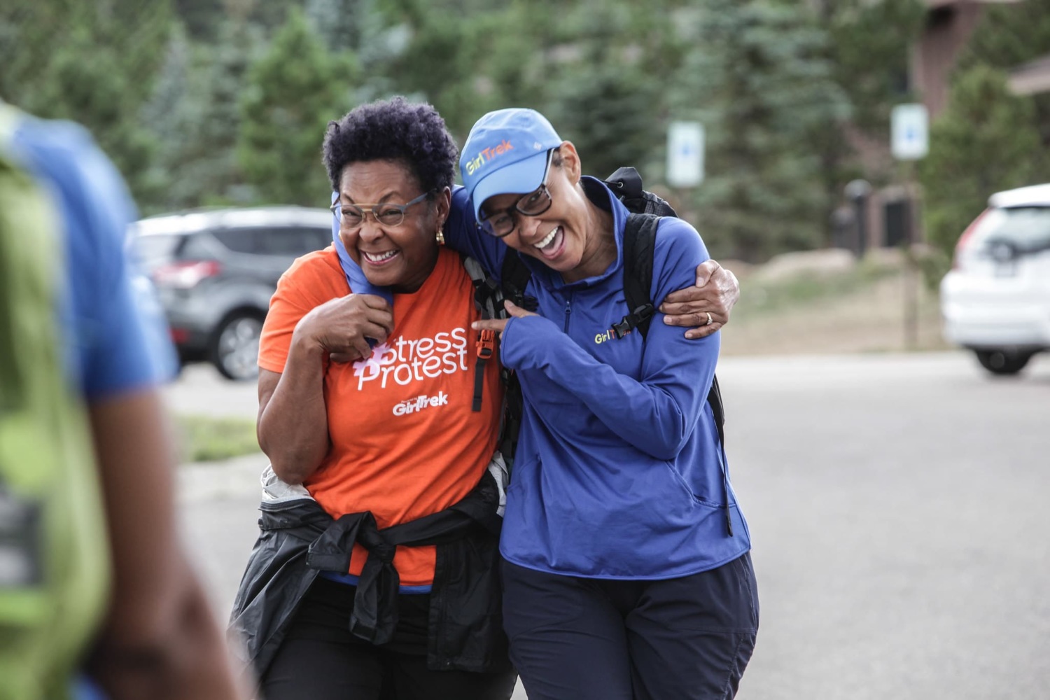 Two Black women in friendly embrace